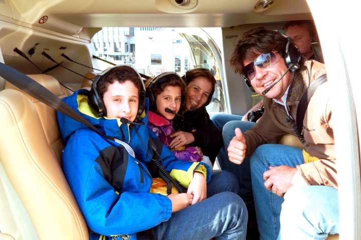 family in helicopter smiling