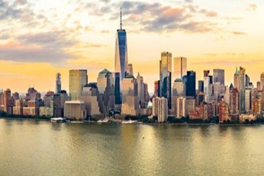 a body of water with a city in the background