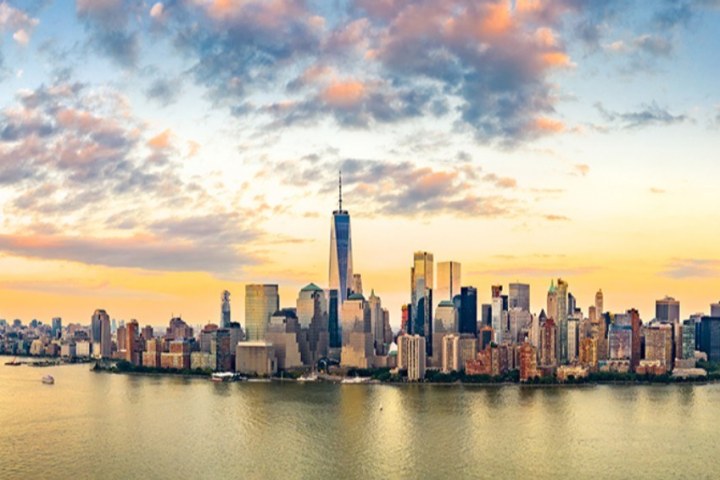 a body of water with a city in the background